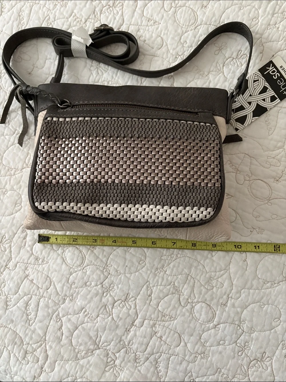 The Sak Leather Messenger Bag in Black and Cream Woven Front